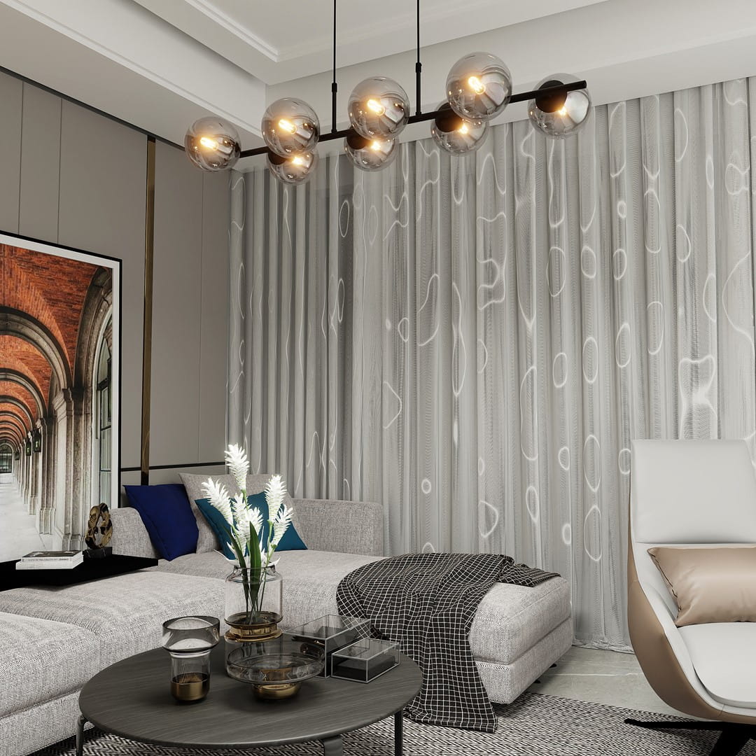 Lampa wisząca Rory 8-punktowa w kolorze czarnym i grafitowym. Posiada osiem szklanych kloszy w kształcie kul, zawieszona na czarnej metalowej konstrukcji. Zawieszona w nowoczesnym wnętrzu, w tle widoczna zasłona i meble.