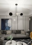 Lampa wisząca czarna 4-punktowa z metalowymi elementami, z okrągłymi kloszami w kolorze czarnym i białym. Ujęcie z góry, zawieszona nad szaro-beżową sofą w nowoczesnym wnętrzu, z obrazem na ścianie i stołem kawowym.