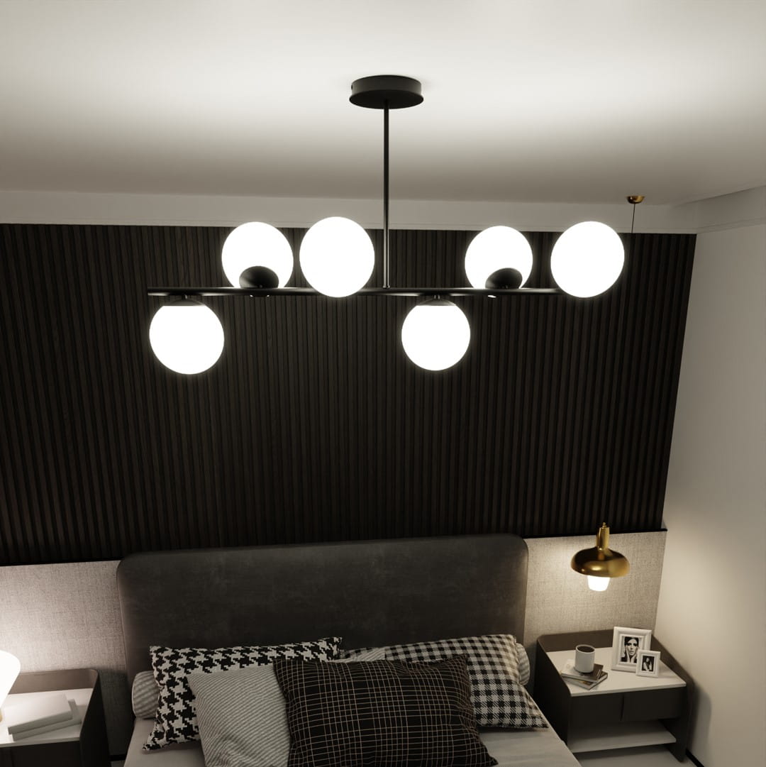 Lampa wisząca Bior 6-punktowa w kolorze czarnym, z sześcioma okrągłymi, białymi kloszami, zamontowana na prostym, metalowym stelażu. Widok z góry w nowoczesnej sypialni, na tle ciemnej, teksturowanej ściany.