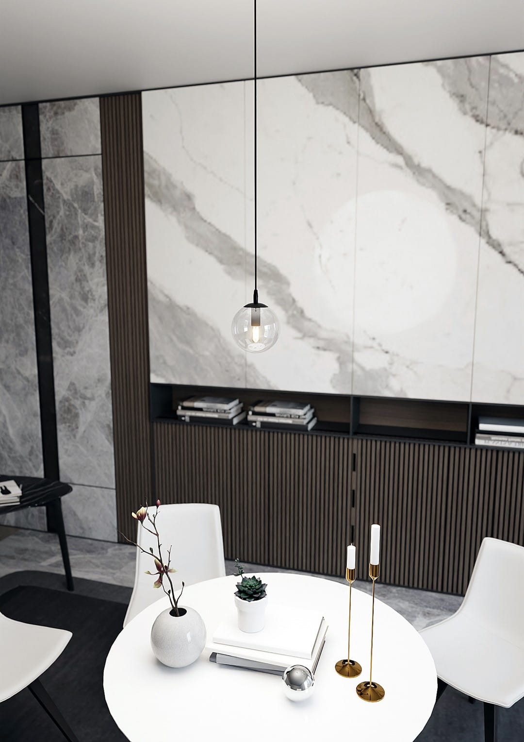 Lampa wisząca Cosmo 1-punktowa, transparentna, z okrągłym kloszem, zawieszona na czarnym kablu. W tle marmurowa ściana i nowoczesne meble. Produkt w aranżacji jadalni, na stole z białym obrusem.