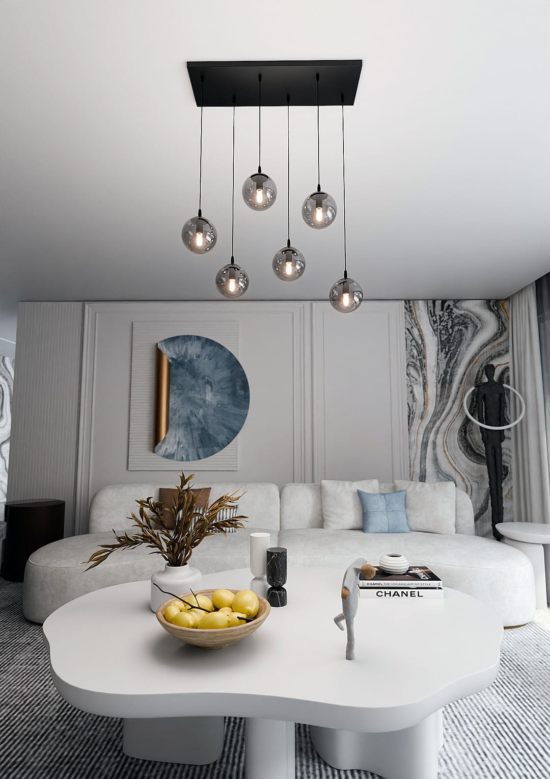 Lampa wisząca Cosmo 6-punktowa w kolorze grafitowym, z sześcioma przezroczystymi kloszami, zawieszona na czarnym stelażu. Ujęcie z góry, pokazujące lampę nad białym, owalnym stołem we wnętrzu.