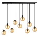 Lampa wisząca Cosmo 9-punktowa, miodowa, składająca się z dziewięciu kulistych kloszy zawieszonych na czarnych linkach. Klosze mają złoty odcień, a całość montowana jest na prostokątnej, czarnej podstawie.