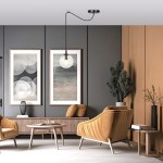 Lampa wisząca Gigi 1-punktowa, transparentna kula zawieszona na cienkim czarnym przewodzie. Umieszczona w nowoczesnym wnętrzu, obok dwóch obrazów na ścianie, w otoczeniu żółtych foteli i drewnianych mebli.