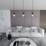 Lampa wisząca Istar 1-punktowa w kolorze miodowym, wykonana z przezroczystego szkła, zawieszona na czarnym przewodzie. W tle widoczna nowoczesna aranżacja wnętrza z jasną sofą i stolikiem kawowym.