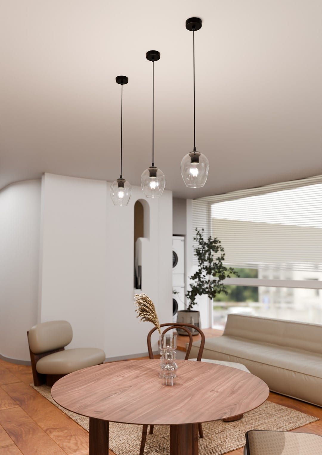 Lampa wisząca Istar 1-punktowa w transparentnym, szklanym kloszu, zawieszona na cienkim, czarnym kablu. Klosz ma zaokrąglony kształt, podkreślający nowoczesny styl.