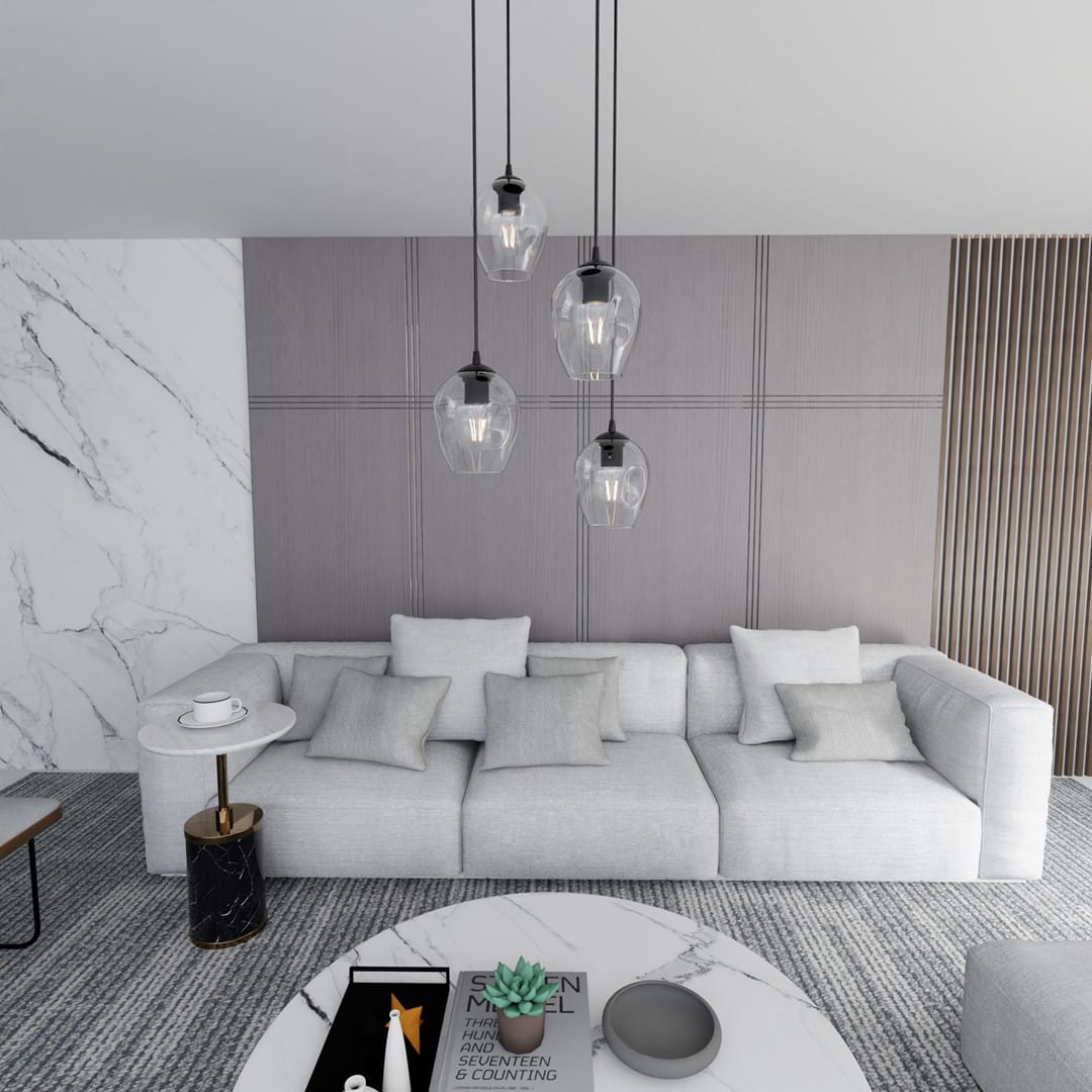 Lampa wisząca Istar Premium 4-punktowa, transparentna, z czterema szklanymi kloszami w kształcie dzwonu, zawieszona na czarnych przewodach, w nowoczesnym wnętrzu z jasną kanapą i stołem kawowym.