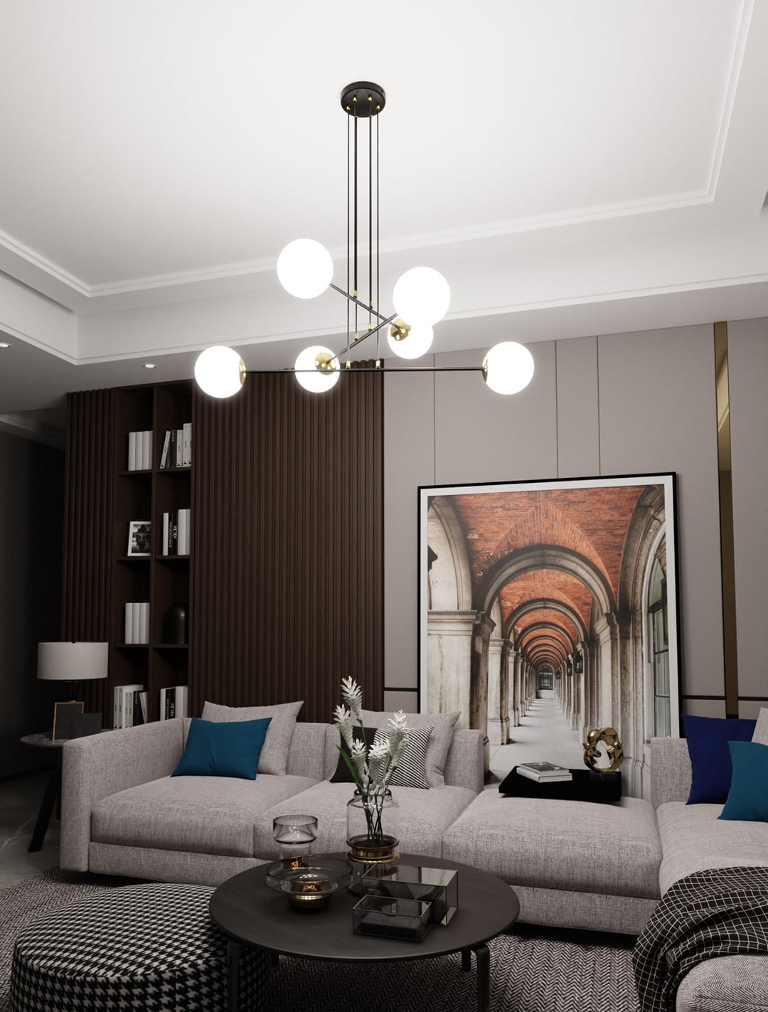 Lampa wisząca Ognis 6-punktowa w kolorze czarnym, z okrągłymi, białymi kloszami i złotymi detalami. Zawieszona na długich linkach z sufitu, doskonale oświetla przestrzeń. Widoczna w nowoczesnym wnętrzu z szaro-beżową sofą i dekoracjami.