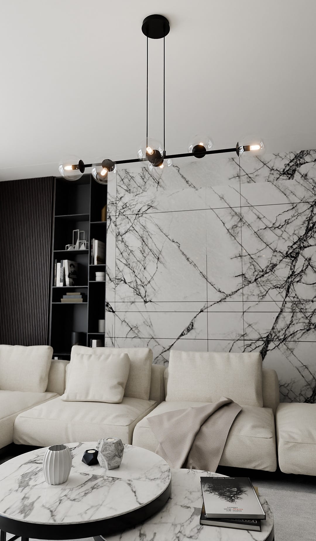 Lampa wisząca Rossi 6-punktowa w kolorze czarnym z transparentnymi kloszami. Zamontowana na suficie, w kształcie prostokąta, z widocznymi żarówkami. Tło w stylu nowoczesnym, z marmurową ścianą i jasnymi meblami.