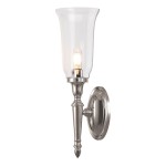 Kinkiet łazienkowy Dryden 1 IP44 w kolorze niklu satynowego, z przezroczystym kloszem w kształcie kielicha. Montowany na ścianie, z widoczną żarówką G9. Elegancki design, idealny do przestrzeni łazienkowych.