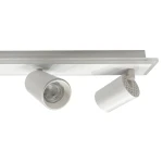 Lampa sufitowa Parma w kolorze białym z pilotem, z czterema źródłami światła GU10 i jednym LED. Kąt ujęcia z góry, pokazujący okrągłe reflektory i prostokątną podstawę. Widoczne detale, w tym perforacje na jednym z reflektorów.