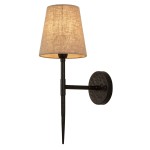 Gothic kinkiet 1xE14 w kolorze czarnym, z metalową podstawą i tekstylnym kloszem w odcieniu jasnego beżu. Ułożony na ścianie, z prostą, elegancką formą oraz widocznym detalem w postaci ozdobnej, okrągłej podstawy.