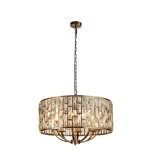 Lampa wisząca Bijou w antycznym mosiądzu, z okrągłym kloszem ozdobionym szklanymi kryształami, zawieszona na łańcuchu. Posiada osiem gniazd E14, układ detali na kloszu tworzy efektowny wzór.