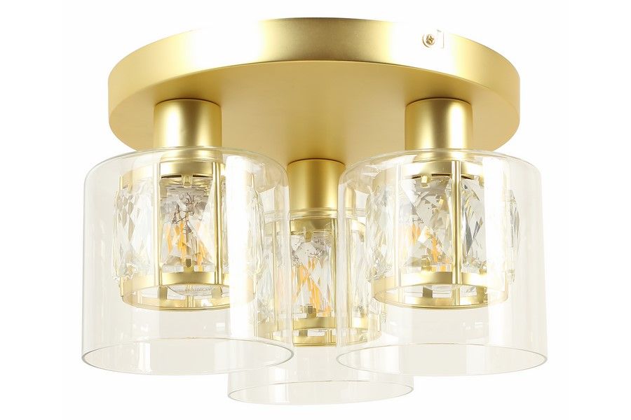 Lampa sufitowa Elmo 3xE14 w kolorze złotym z przezroczystymi kloszami. Trzy cylindryczne klosze z kryształowymi detalami, zamontowane na okrągłej, złotej podstawie. Produkt w pozycji wiszącej, idealny do nowoczesnych wnętrz.