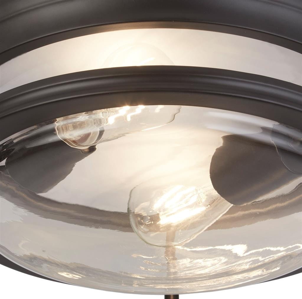 Czarna lampa sufitowa Glasgow z podwójnym źródłem światła E27, IP44. Okrągła, szklana klosz z przezroczystym wykończeniem, widoczne żarówki. Ujęcie z bliska, pokazujące detale lampy i jej elegancki design.