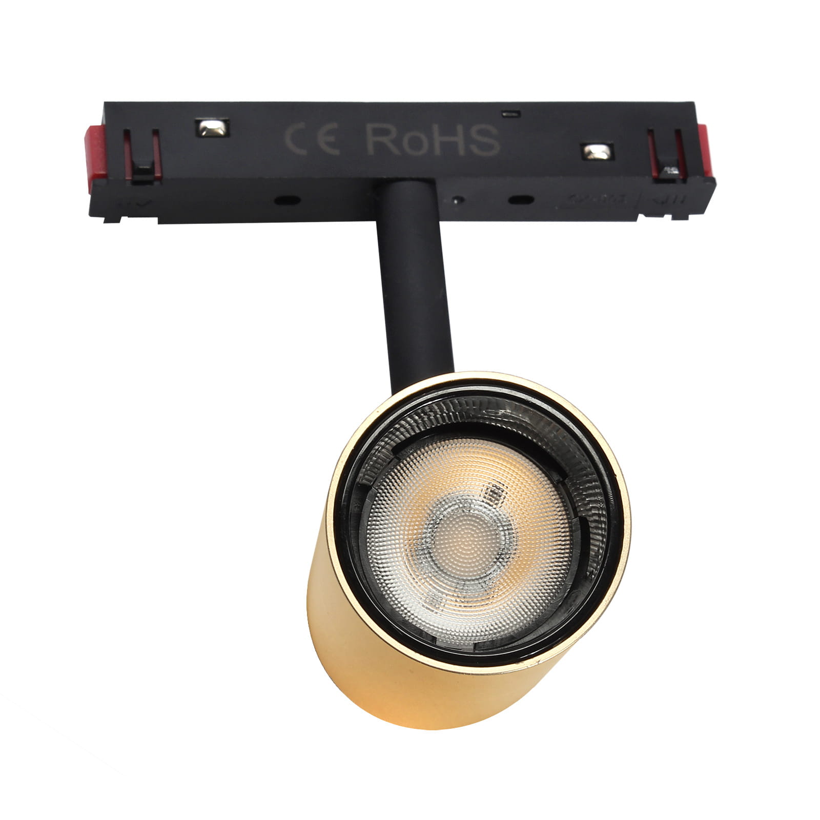 Reflektor spot LED do szyny magnetycznej, 7W, barwa światła 3000K, w kolorze złotym. Ujęcie z góry, widoczny okrągły klosz z przezroczystą osłoną, zamontowany na czarnej szynie. Brak widocznych napisów.