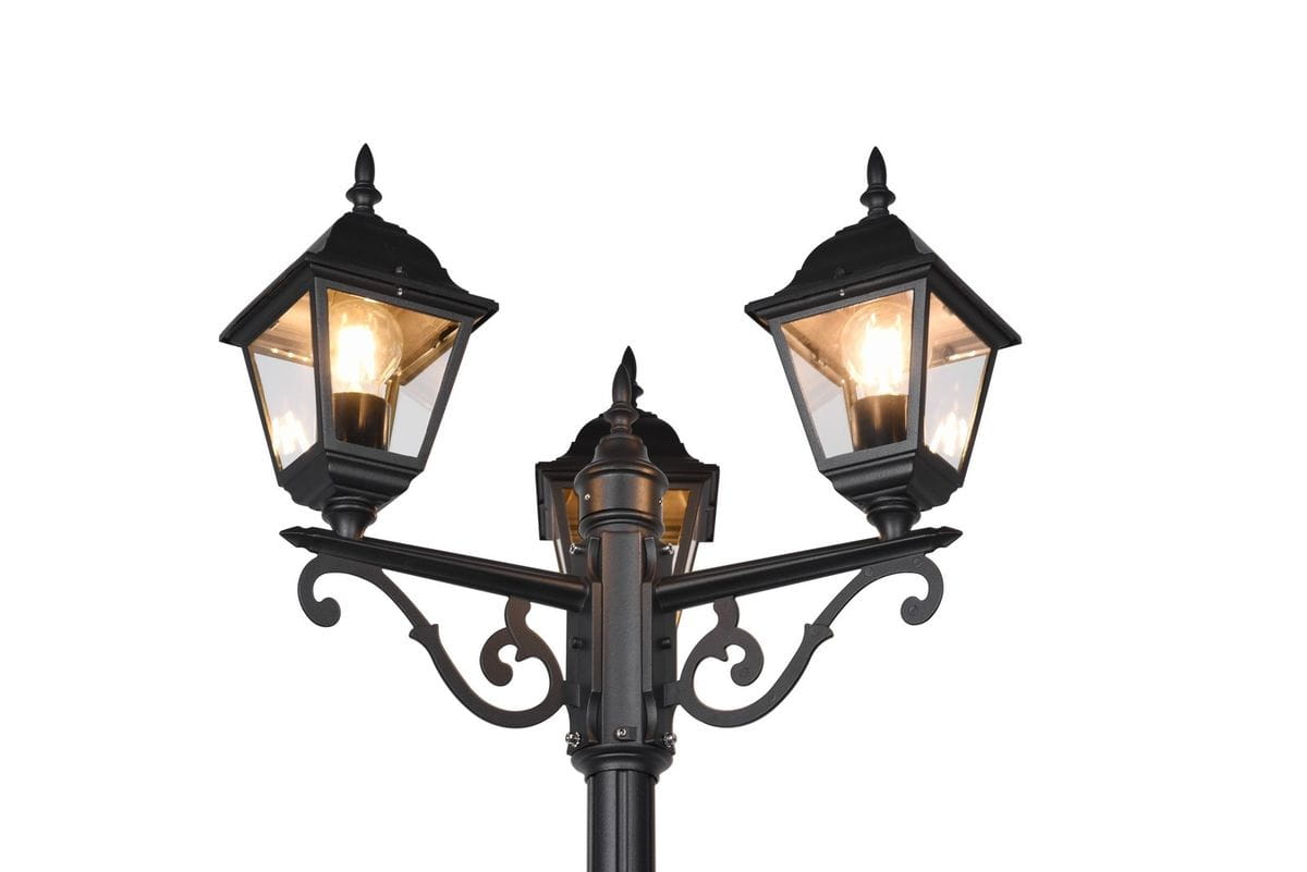 Lampa stojąca Livenza H200 w kolorze czarnym z trzema kloszami E27. Klosze w kształcie latarni, z ozdobnymi detalami, umieszczone na prostym słupie. Widok z góry, ukazujący kształt i konstrukcję lampy.