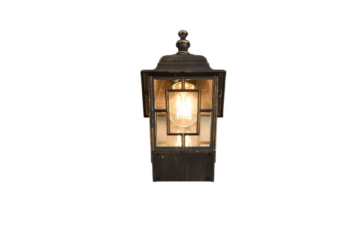 Kinkiet zewnętrzny Volturno w kolorze antycznej rdzy, z zamkniętą żarówką E27. Lampa ma prostokątny kształt, z przezroczystymi panelami i dekoracyjnym daszkiem. Ujęcie frontalne, produkt wiszący, idealny do elewacji budynków.