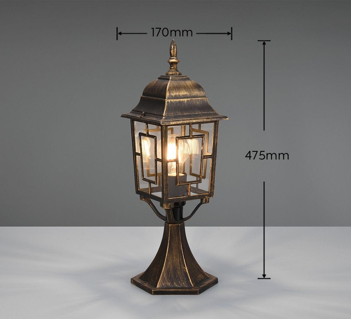 Lampa stojąca ogrodowa Volturno H47,5 cm w kolorze antycznej rdzy, z kloszem w geometryczny wzór, z podstawą w kształcie prostokąta. Wymiary: wysokość 475 mm, szerokość 170 mm. Przeznaczona na żarówkę E27.
