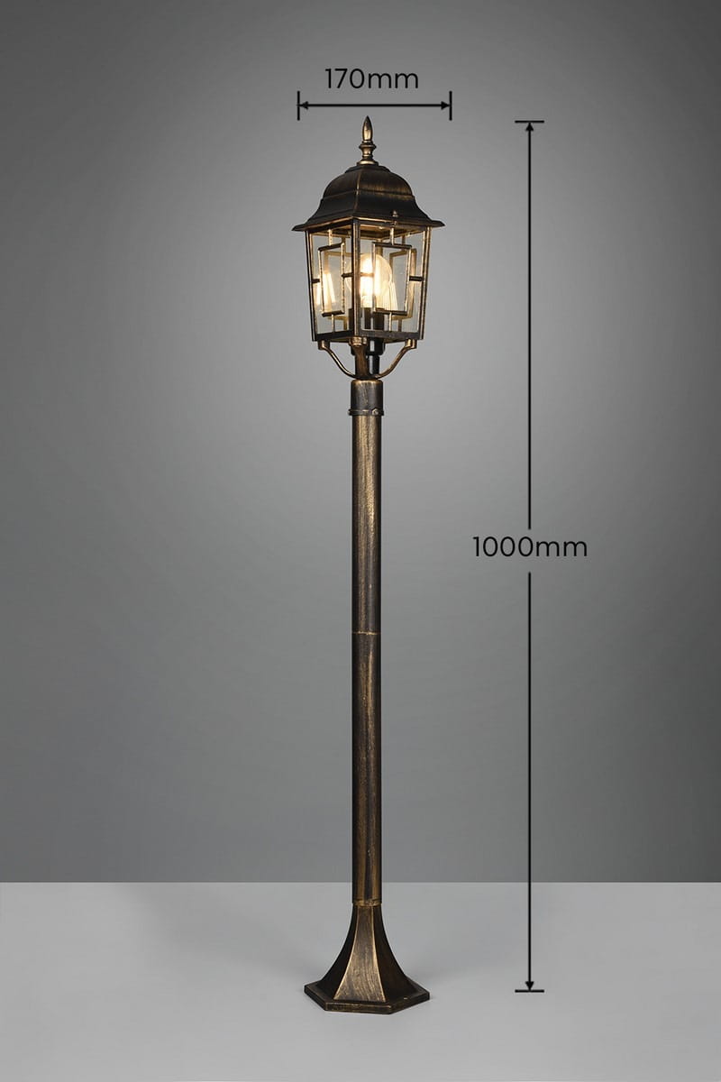 Lampa stojąca ogrodowa Volturno H100 w antycznej rdzy, z kloszem o wymiarach 170 mm, wysoka na 1000 mm. Posiada ozdobny, sześciokątny słup oraz stylowy daszek, idealna do oświetlenia przestrzeni ogrodowej.