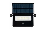 Naświetlacz solarny LED 20W z czujnikiem ruchu, kolor czarny. Widoczna płyta słoneczna na górze oraz biała lampa z dziesięcioma diodami LED. Ujęcie frontalne, produkt w pozycji stojącej, z czujnikiem umieszczonym pod diodami.