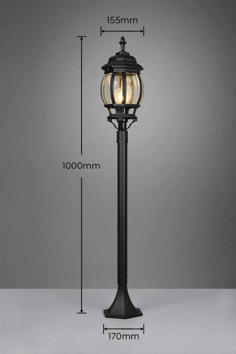 Lampa stojąca ogrodowa Elvo H100 w kolorze czarnym, z oprawą na jedną żarówkę E27. Wysokość 1000 mm, średnica klosza 155 mm, podstawka 170 mm. Stylowy design z przezroczystym kloszem, umieszczona w pozycji stojącej.