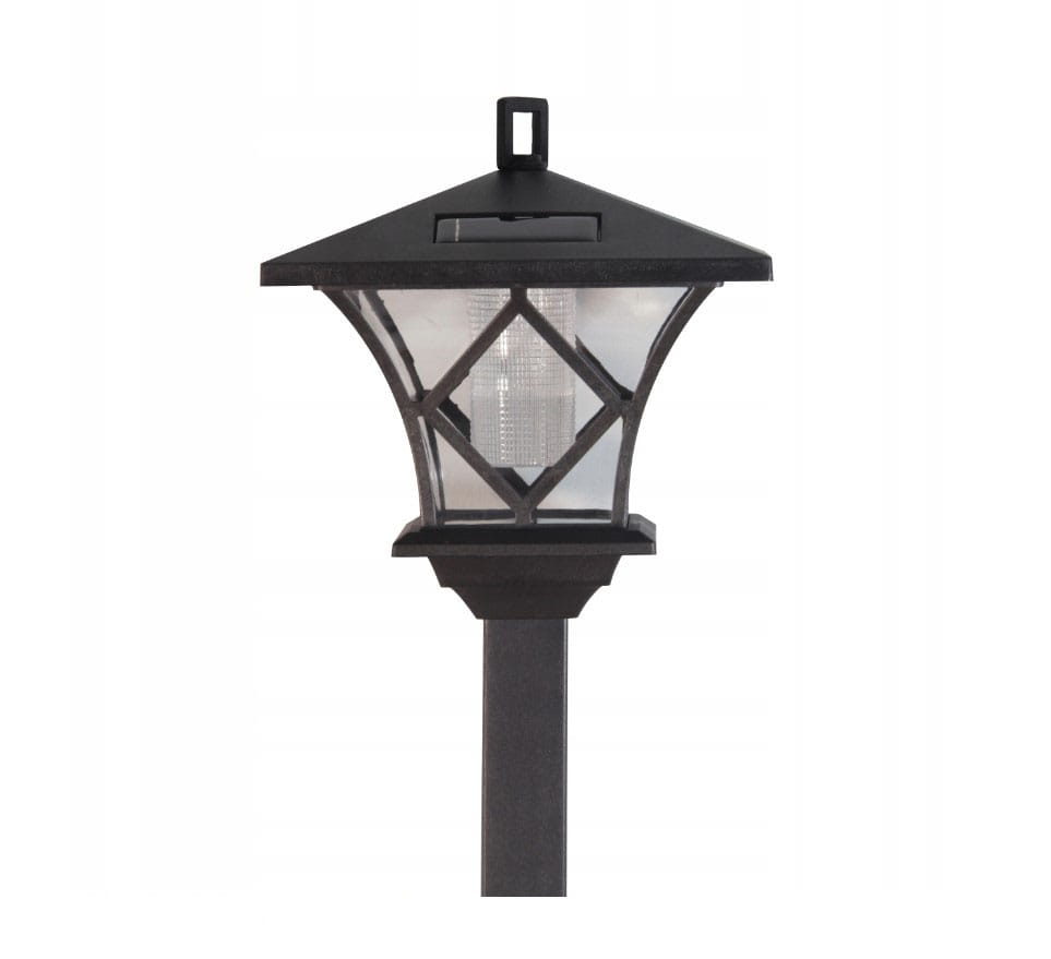 Lampa solarna ogrodowa z czujnikiem zmierzchu LED/H138 w kolorze czarnym. Posiada szklany klosz z geometrycznym wzorem i prostokątną podstawę. Ujęcie frontalne, stojąca na słupku, z widocznym panelem słonecznym na górze. Idealna do oświetlenia ogrodu.