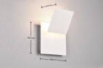 Mio kinkiet LED 6W w kolorze białym, z prostokątną podstawą o wymiarach 180x180 mm, z wysuniętym kloszem o wymiarach 65x180 mm. Zainstalowany na szarym tle, emituje światło w górę, na ścianie.