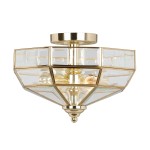 Lampa sufitowa Old Park z polerowanego mosiądzu, z przezroczystymi panelami. Ośmiokątna konstrukcja z dwoma oprawami E27, montowana sufitowo. Złote detale i elegancki design. Wymiary: średnica i wysokość niewidoczne.
