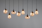 Lampa wisząca Lumina z 8 kloszami E14 w kolorze czarnym i bursztynowym. Klosze mają różne kształty, zawieszone na cienkich linkach, tworząc asymetryczny układ. Tło jest szare, co podkreśla elegancję lampy.