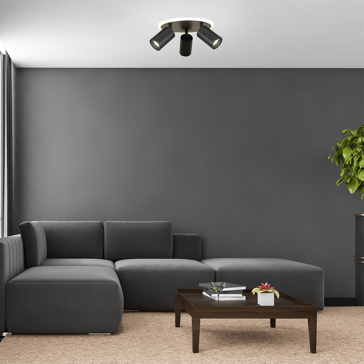 Lampa sufitowa Parma 3xGU10 + 1xLED w kolorze czarnym, okrągła, z trzema regulowanymi punktami świetlnymi, zamontowana na białym suficie. W tle widoczny szary salon z sofą i stolikiem kawowym.
