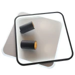 Lampa sufitowa Parma 2xGU10 w kolorze czarnym z dwiema cylindrycznymi oprawami LED. Produkt ma kwadratowy kształt z białą ramką i lekko szarym tłem. Ujęcie z góry, pokazujące detale mocowania oraz wykończenie w środku opraw.