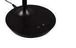 Czarna lampa stołowa Toro z podstawą o okrągłym kształcie. Widoczny przycisk z oznaczeniem ON/OFF oraz M. Ujęcie z góry, prezentujące detale podstawy i kable.