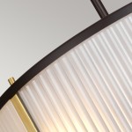 Lampa wisząca Corona w starym brązie, z kloszem w przezroczystym, prążkowanym materiale. Widoczne złote detale oraz mocowanie. Ujęcie z góry, ukazujące kształt i teksturę klosza. Dostosowana do trzech żarówek E27.