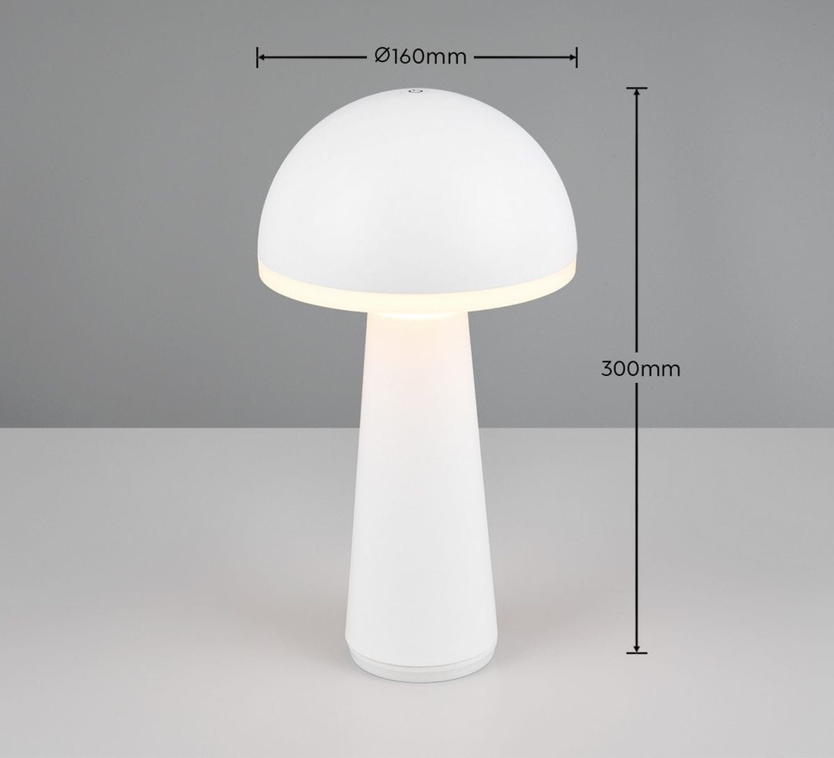 Lampa stołowa Fungo zewnętrzna, biała, o kształcie grzyba. Wysokość 300 mm, średnica klosza 160 mm. Wykonana z materiału, emituje ciepłe światło LED o mocy 2W. Umieszczona na płaskiej powierzchni, z minimalistycznym designem.