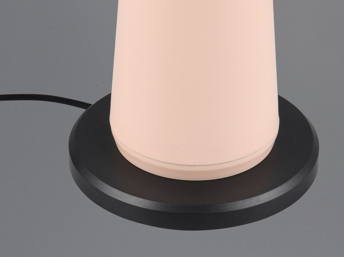 Lampa stołowa Fungo zewnętrzna z piaskowym, matowym kloszem w kształcie walca, osadzona na okrągłej, czarnej podstawie. Widoczny przewód zasilający. Idealna do użytku na zewnątrz.