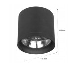 Lampa sufitowa tuba Bari w kolorze czarnym, z pojedynczym gniazdem GU10, o średnicy 118 mm i wysokości 110 mm. Widoczna metaliczna osłona reflektora wewnętrznego. Ujęcie frontalne, zbliżenie na detal konstrukcji lampy.