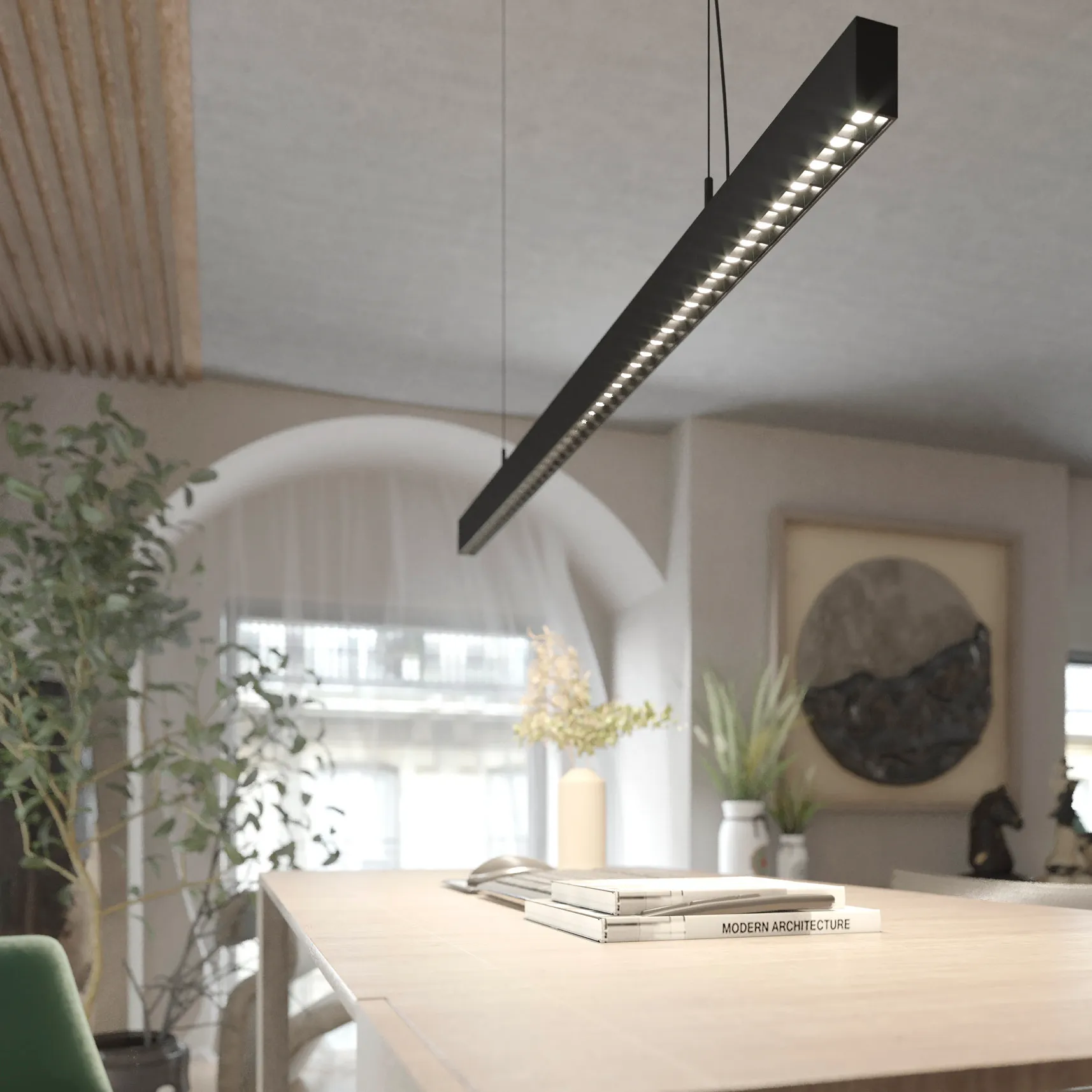 Lampa wisząca Sigi I w kolorze czarnym, o prostokątnym kształcie, z jedną diodą LED (36W, 3000K). Zawieszona nad drewnianym blatem, otoczona roślinnością, w nowoczesnym wnętrzu z jasnym tłem.