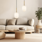 Lampa wisząca Alias D12 z jednym gniazdem E14, złote elementy metalowe, matowe szklane klosze w kształcie owalnym. Zawieszona nad stolikiem kawowym w jasnym, nowoczesnym wnętrzu z kanapą i rośliną.