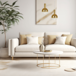 Lampa wisząca Toronto 1xGU10 w kolorze złotym, zawieszona nad białą sofą z poduszkami w odcieniach beżu. Dwa kuliste klosze z metalicznymi elementami, w minimalistycznym wnętrzu z roślinnością oraz okrągłym stolikiem kawowym.