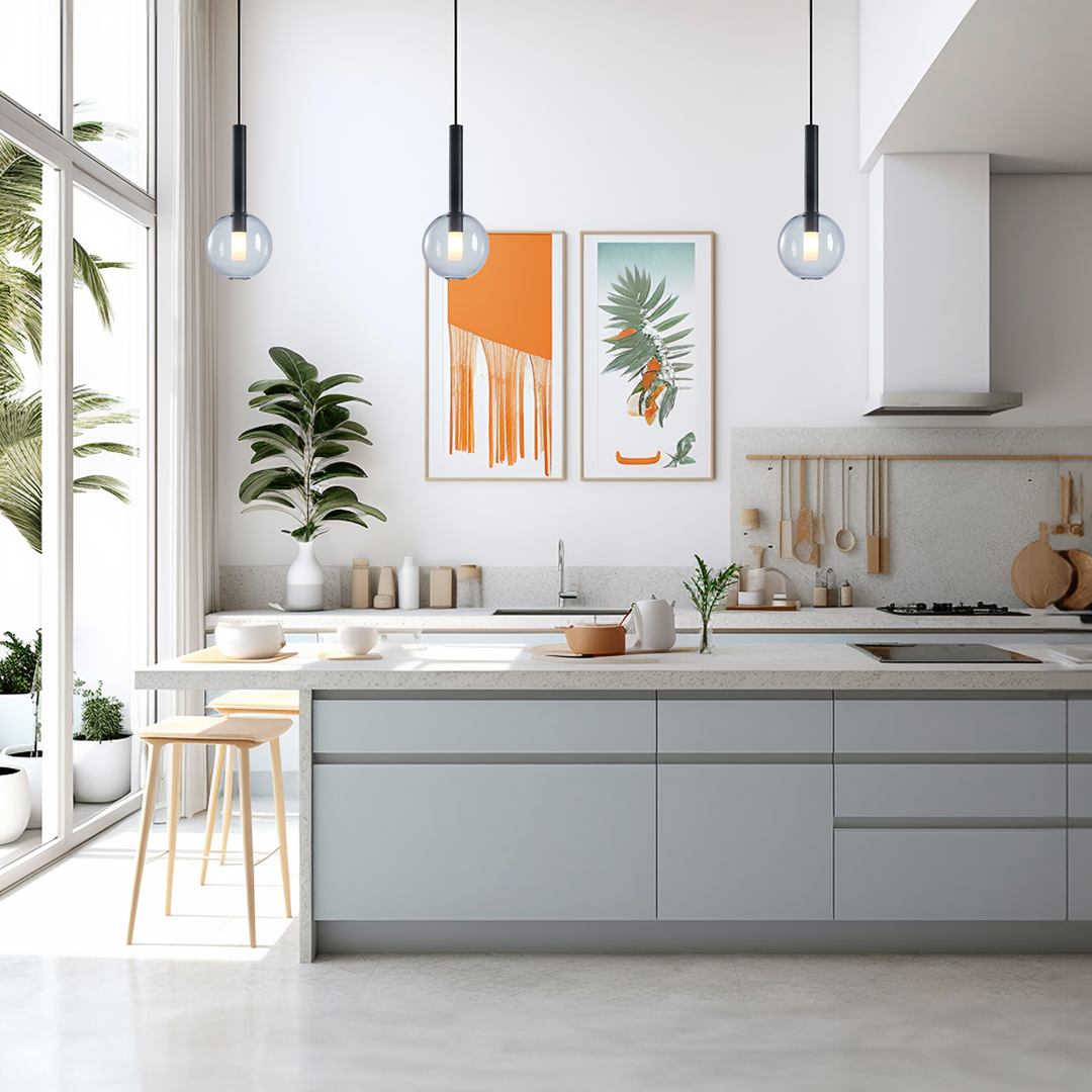 Lampa wisząca Niko D15 w kolorze czarnym, z jednym gniazdem G9. Stylowy, cylindryczny kształt, zawieszona w nowoczesnej kuchni. W tle widoczne rośliny oraz dekoracyjne obrazy na ścianie.