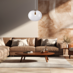 Lampa wisząca Campania z transparentnym kloszem i złotym wykończeniem, zawieszona nad brązową sofą. Klosz ma okrągły kształt, a lampa jest umieszczona w jasnym wnętrzu z marmurową ścianą.