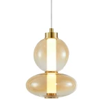 Lampa wisząca Daphne z jednym źródłem LED o mocy 12W w złotym wykończeniu. Składa się z dwóch szklanych kul o przezroczystym bursztynowym kolorze, z centralnym białym elementem. Zawieszona na cienkim przewodzie.