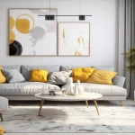 Czarna lampa wisząca Genesis z pięcioma punktami świetlnymi GU10, zawieszona nad jasnoszarym sofą z poduszkami w odcieniach żółtego i szarego. Lampa ma minimalistyczny design i jest zamontowana na długim zwisie.