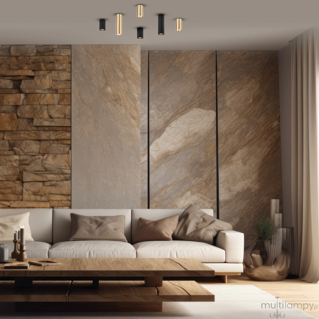 Czarna lampa sufitowa Genesis H10 z jednym gniazdem GU10, zawieszona na tle nowoczesnego wnętrza z kamienną ścianą. Lampa ma cylindryczny kształt, z metalicznymi elementami, podkreślając elegancki styl aranżacji.