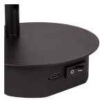 Czarny kinkiet Jolijn zasilany bateryjnie, widok z boku. Na podstawie znajduje się port USB-C oraz przełącznik zasilania. Okrągła, matowa podstawa z prostym designem, idealna do nowoczesnych wnętrz.