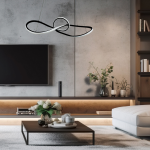Lampa wisząca Marco w kolorze czarnym, z efektem podwójnej pętli, zawieszona nad stolikiem w nowoczesnym wnętrzu. Wykonana z materiałów metalowych, z wbudowanym źródłem LED o mocy 42W, idealna do oświetlenia salonu.