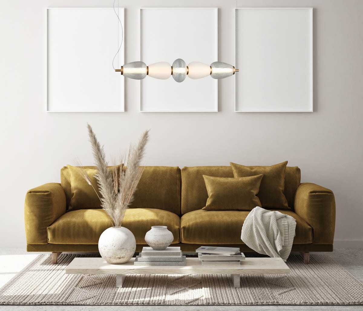 Lampa wisząca Gastel 1xLED/22W w kolorze czarnym, zawieszona nad kanapą, z dekoracyjnymi elementami w kształcie owalnym oraz metalowymi wykończeniami. Otoczenie obejmuje stół z dekoracjami i naturalnymi akcentami, na jasnym tle.