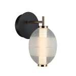 Kinkiet Rinot 1xLED/8W w kolorze czarnym z okrągłą podstawą. Szklana klosz o owalnym kształcie z matowym i przezroczystym wykończeniem, z metalowymi detalami w kolorze złotym. Montowany na ścianie, w pozycji poziomej.