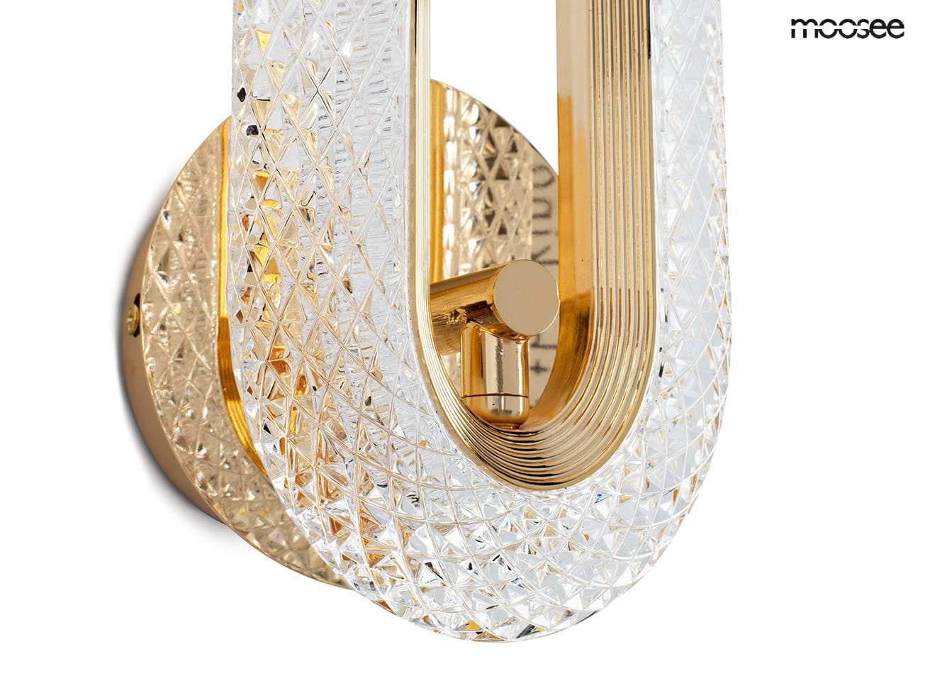 Kinkiet Jewel 1xLED/7W w kolorze złotym, z przezroczystym kloszem o fakturze diamentowej. Ujęcie z boku, pokazujące okrągłą podstawę i detale konstrukcyjne. Elegancki design, idealny do nowoczesnych wnętrz.