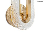 Kinkiet Jewel 1xLED/7W w kolorze złotym, z przezroczystym kloszem o fakturze diamentowej. Ujęcie z boku, pokazujące okrągłą podstawę i detale konstrukcyjne. Elegancki design, idealny do nowoczesnych wnętrz.